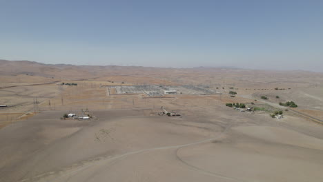 Distant-Power-Plant-In-Desert-Landscape