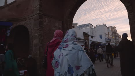 Women-wearing-headscarves-hijab-walk-through-the-Medina-of-Essaouira-Morocco-port-city