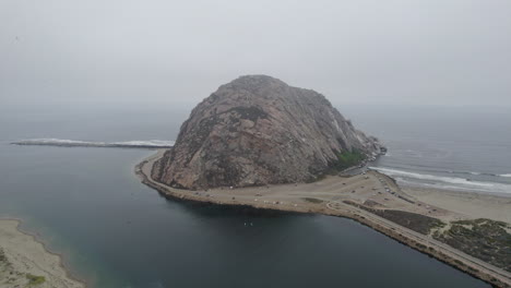 Aerial-View-Of-Morro-Rock-And-Beach-In-Morning-Fog