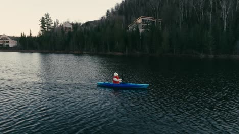 Tourist-Oaring-While-Kayaking-In-Lake---drone-shot