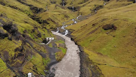 Aerial-of-Seljavallalaug-natural-hot-spring-Swimming-Pool-with-dramatic-mountains