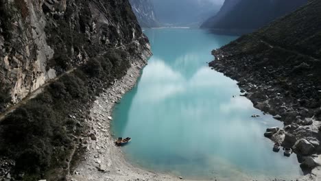 Laguna-Paron-Turquoise-Lake,-Aerial-Drone-Above-Mountains-Cordillera-Blanca-Peru-Water-Expanse,-Peruvian-Andes-Trekking-Region