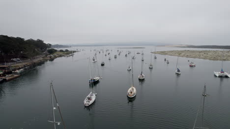 Aerial-Flying-Over-Moored-Boats-In-Marina-In-Morro-Bay-On-Overcast-Day