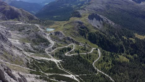 Aerial-view-over-Valparola-Pass-with-views-of-Marmolada-Mountain,-Dolomites