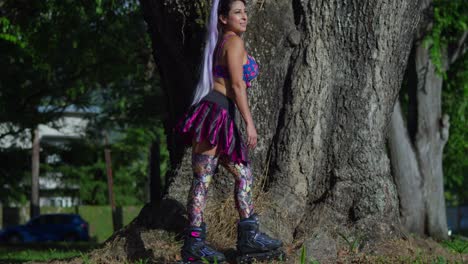 Young-girl-wears-roller-blades-mini-skirt-and-leggings-at-the-park-on-a-sunny-day