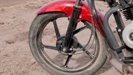 close-up-shot-of-the-front-wheel-of-a-bajaj-motorcycle-imported-to-africa
