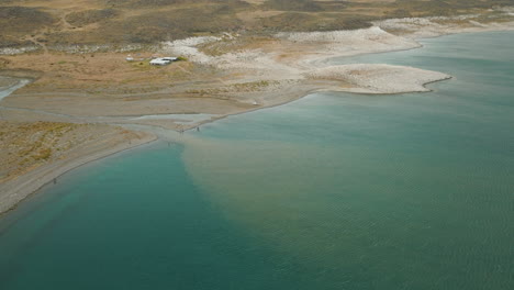 Stunning-drone-shot-overlooking-"Jurassic-Lake",-Argentina