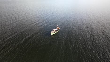 Lure-fishing-boat-on-large-silver-lake,-Ireland