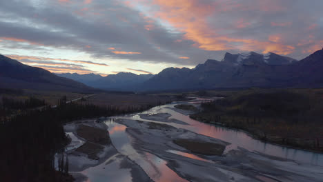 Flight-over-beautiful-Rocky-Mountain-river-valley-at-sunrise,-Nordegg,-Alberta,-Canada