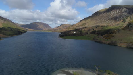 Aerial-Drone-Shot-Looking-Down-Buttermere-Lake-with-Robinson-and-Mellbreak-Fell-in-View-on-Sunny-and-Cloudy-Day-Lake-District-Cumbria-United-Kingdom