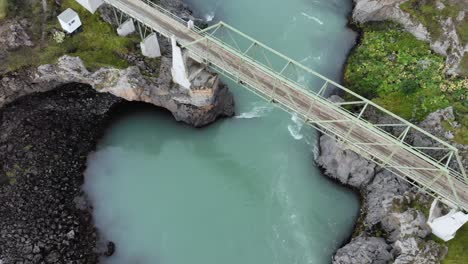 Top-down-aerial-of-Godafoss-glacier-blue-green-waterfall-in-Iceland