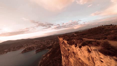 FPV-aerial-above-some-cliffs-with-the-view-of-cassis-in-the-background-