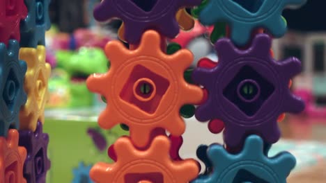 Colorful-kids-gears-spinning,-close-up