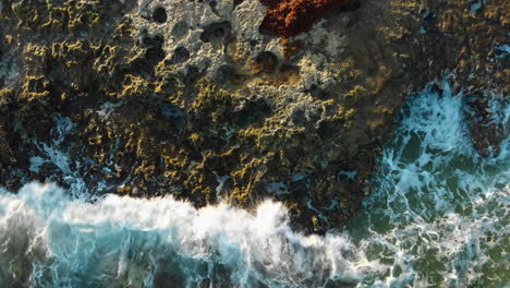 Drone-shot-of-crashing-waves-on-rocks-in-Mexico-ocean