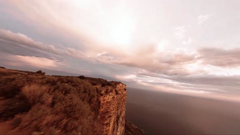 FPV-aerial-view-of-a-huge-cliff-that-meets-the-mediterranean-sea-in-Southern-france