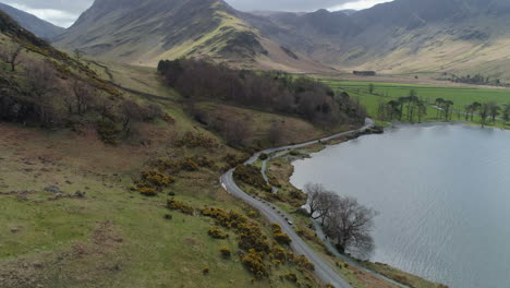 Aerial-Drone-Shot-of-Buttermere-Lake-Panning-up-to-Reveal-Fleetwith-Pike-Fell-Lake-District-Cumbria-United-Kingdom