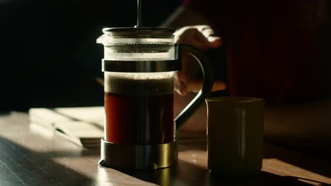 French-press-coffee-brewing-in-harsh-sunlight