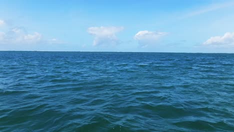 view-of-a-choppy-ocean-under-a-blue-sky