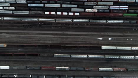 Top-down-of-railroad-train-cars-on-tracks