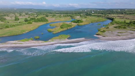Nizao-River-Mouth,-Beach-And-Blue-Sea-During-Summer-In-Sabana-Grande-de-Palenque,-Dominican-Republic