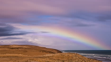Coastal-rainbow-and-cloudscape-fusion-time-lapse,-bright-warm-colors