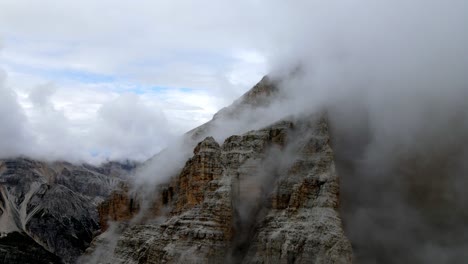 Aerial-views-of-italian-Dolomites-peaks-in-a-foggy-and-cloudy-day
