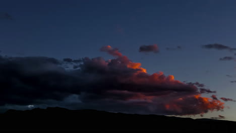 Golden-clouds-at-dusk-sky-changing-to-dark-after-sunset---time-lapse-shot