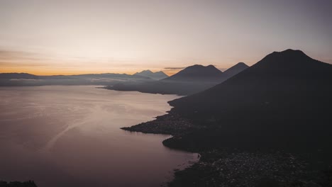 Dangerous-and-active-Fuego-volcano-near-lake-Atitlan,-morning-sunrise-time-lapse
