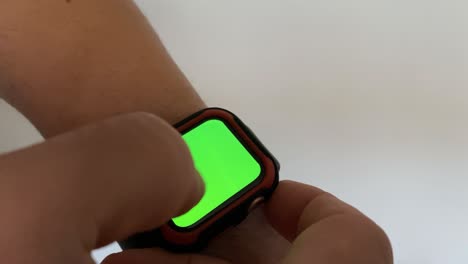 Macro-Chroma-Green-Smart-Watch-Close-Up,-Young-Business-Man-doing-scroll-top-down-on-Technology-App
