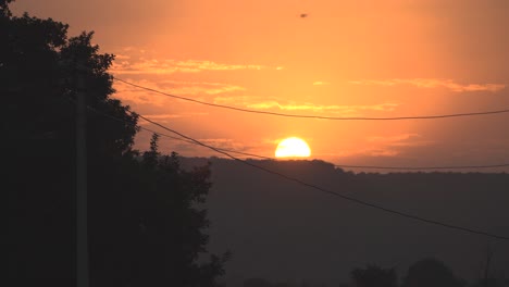 Sun-setting-behind-hills-during-time-of-Sunset-at-hills-of-Shivpuri-,-Madhya-Pradesh