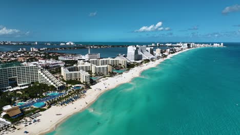Aerial-view-of-beaches-and-the-Hotel-zone,-sunny-day-in-Cancun,-Mexico---rising,-drone-shot