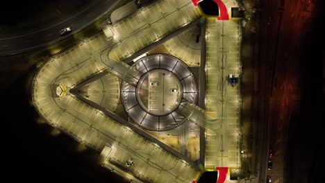 Drone-shot-of-multi-story-car-park-at-night-time