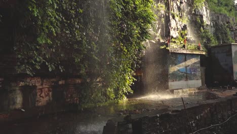 Slowmotion-shot-of-a-Waterfall-flowing-at-a-temple-of-Shivpuri-Madhya-Pradesh-,-India