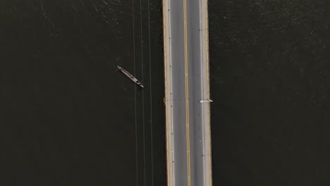 Birds-eye-view-bridge-over-the-river-and-passing-traffic