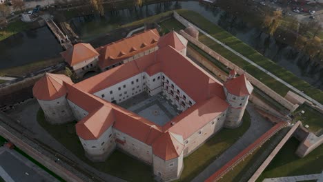 Static-aerial-drone-flight-over-the-castle-Cetatea-Făgărașulu-in-Făgăraș-in-România---Fagaras-in-Romania-is-a-touristic-city-in-the-historical-region-of-Transylvania-near-the-Olt-River---bird-view