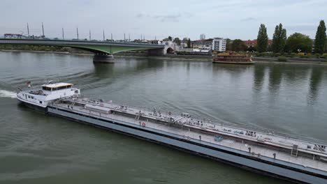 Boat-drifting-slowly-on-the-Rhein-River-in-Bonn,-Germany