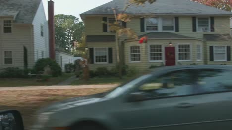 Driving-past-a-historic-neighborhood-at-fall-time