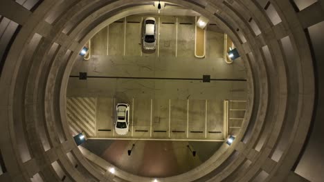 Drone-shot-of-multi-story-car-park-at-night-time