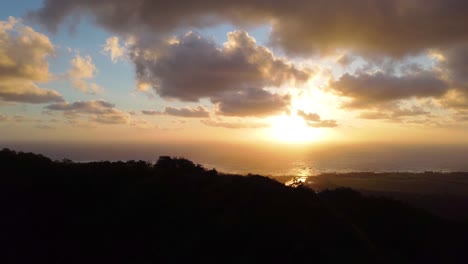 Aerial-mountain-sunrise-footage-revealing-Pacific-Ocean-view