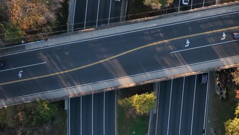 An-aerial,-top-down-view-over-a-highway-in-slow-motion