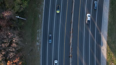An-aerial,-top-down-view-over-a-highway-shot-in-slow-motion-on-Long-Island,-NY