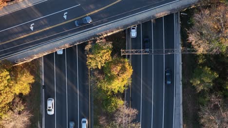 An-aerial,-top-down-view-over-a-highway-which-was-shot-in-slow-motion