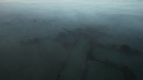English-countryside-from-above,-on-a-foggy-misty-morning