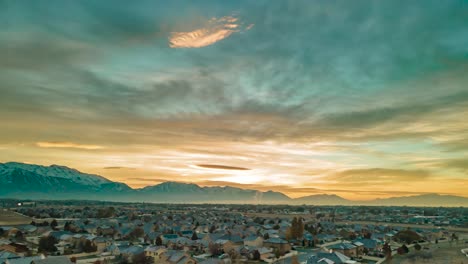 Glorious-golden-sunrise-in-Lehi-Utah-on-a-hazy-morning-in-winter---aerial-hyper-lapse
