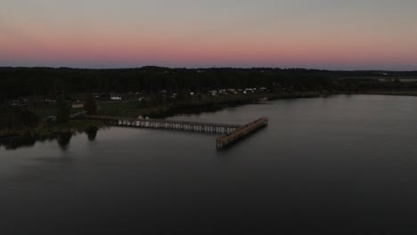 Aerial-approach-to-Meaher-State-Park-at-dusk-in-Spanish-Fort,-Alabama