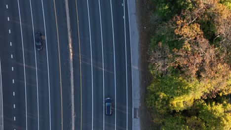 An-aerial,-top-down-view-over-a-highway-in-slow-motion