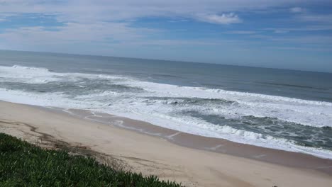 Wide-shot-of-popular-Portuguese-surfers-beach-in-Nazare-Portugal