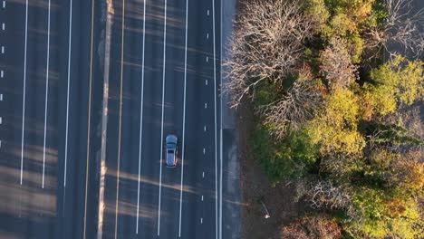 An-aerial,-top-down-view-over-a-highway-shot-in-slow-motion