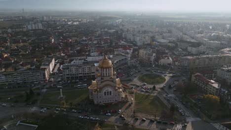 Static-aerial-drone-flight-around-over-orthodox-church-cathedral-Catedrala-Sfântul-Ioan-Botezătorul-of-Făgăraș-in-România---bird-view-of-Fagaras-in-Romania-in-winter-with-roundabout