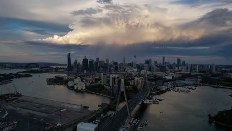 An-aerial-shot-of-storm-cloud-during-sunset-appears-behind-Sydney-City-with-the-ANZAC-Bridge-in-the-foreground